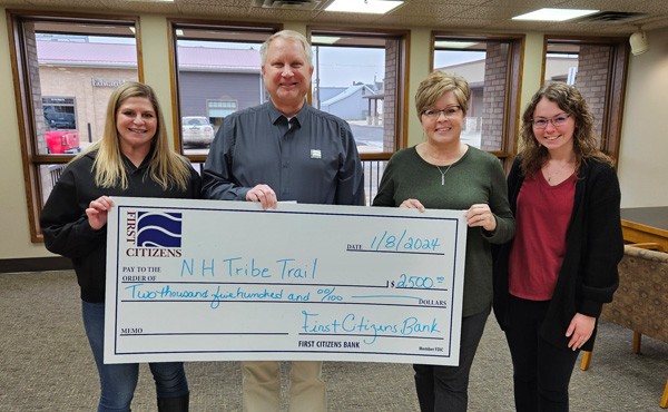 $2,500 donation to the City of New Hampton Parks and Recreation for the TRIBE Trail