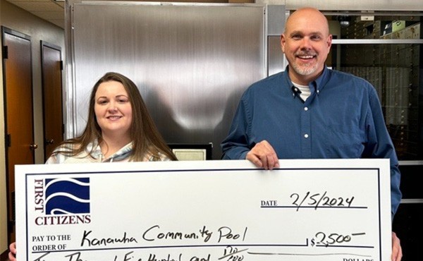 $2,500 donation to the Kanawha Swimming Pool. Pictured is FCB employee Ryan E with Jessica F.