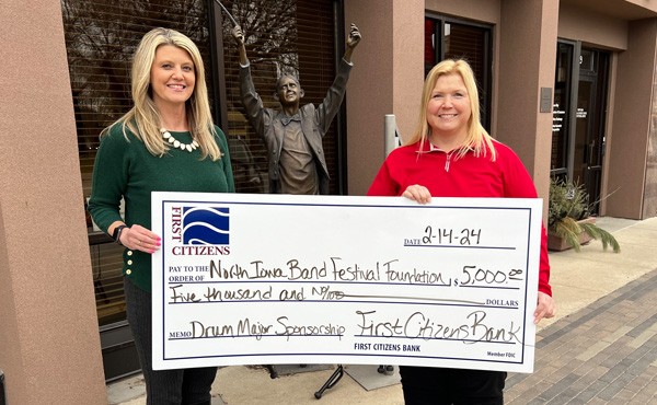 $5,000 donation to the North Iowa Band Festival Foundation towards a Drum Major Sponsorship. Pictured is Band Festival Committee Chair, Amy F with FCB employee Julie B.