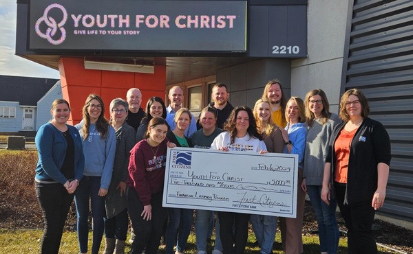 $5,000 donation to Youth For Christ to use towards financial literacy programming. Pictured are FCB employees Jaclyn M and Lindsay H with representatives from Youth for Christ.