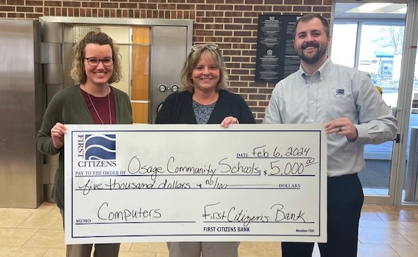 $5,000 donation to Osage Community School to use for purchasing computers. Pictured are FCB employees Laura K and Trever O with Kelley M.