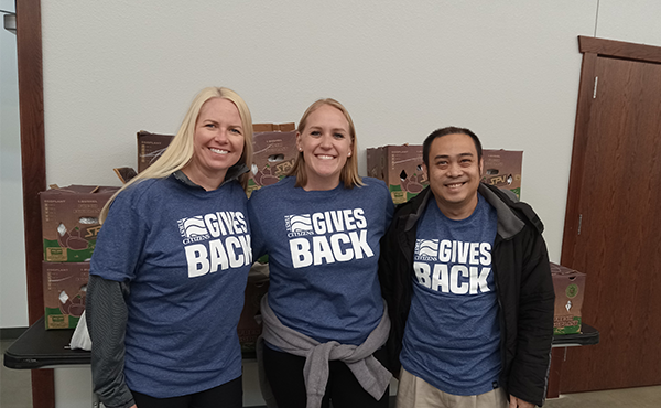 Natalie, Paige, and Arcon volunteered at the Charles City Mobile Pantry