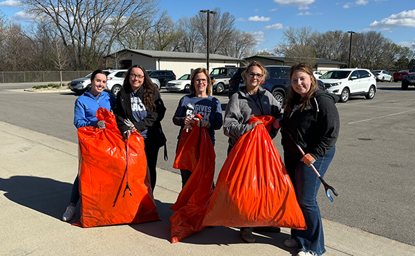 MCW staff Leah, Nyah, Jill, Sami, and Carlie helping with Earth Day cleanup