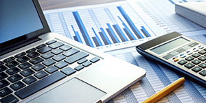 person handing check to another person