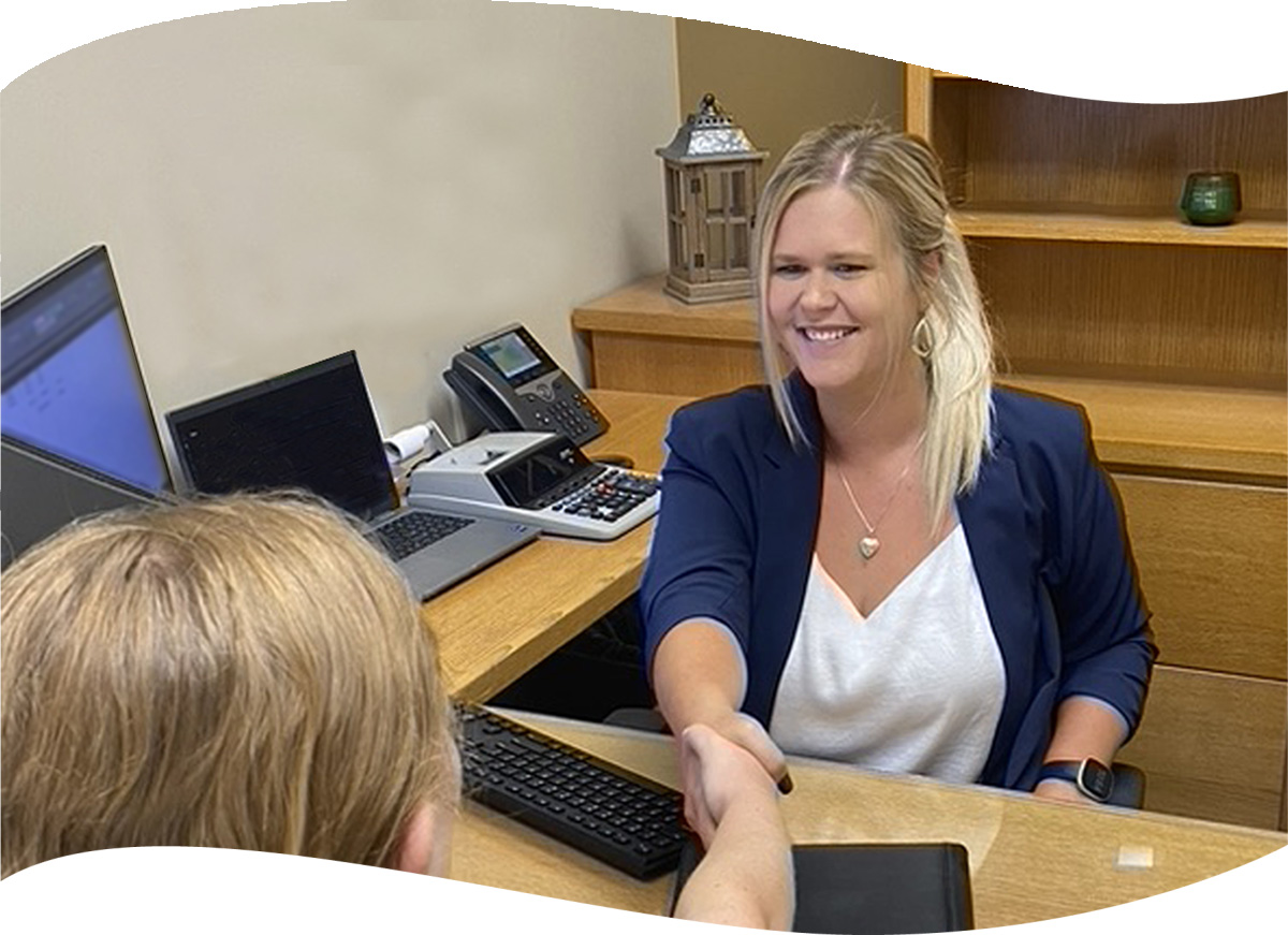 first citizens employee shaking customer's hand in office
